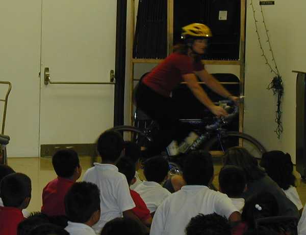 President Cheri Demonstrating Safety on her bike